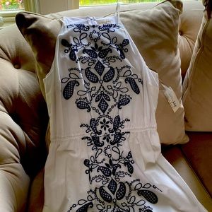 Summer dress with navy embroidery down the center. Never worn. Size medium.